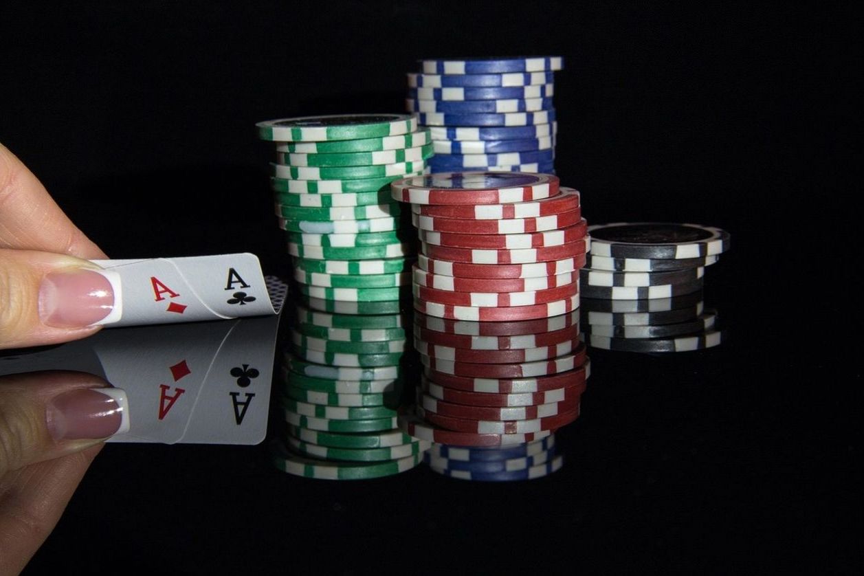 OfferRushPoint interior with premium poker tables and warm ambient lighting