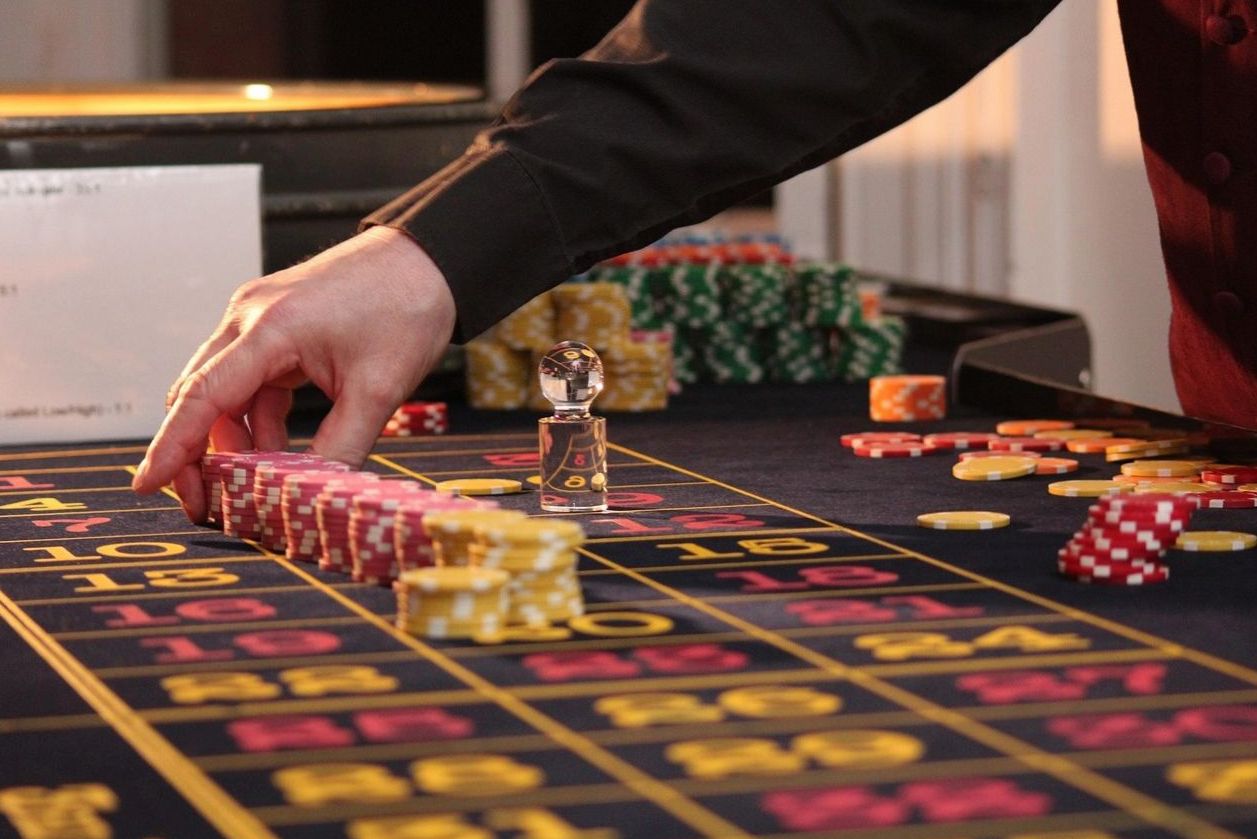 The OfferRushPoint gaming room with soft lighting and tables
